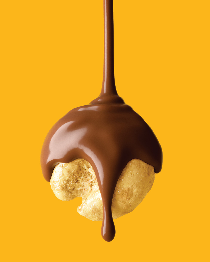 Chocolate escorrendo sobre pipoca caramelizada — CGI 3D do Bauducco Choco Pipoca